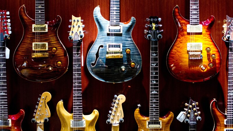 Electric Guitars on Display — Brown