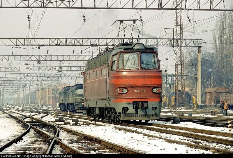 Electric locomotive on snowy tracks