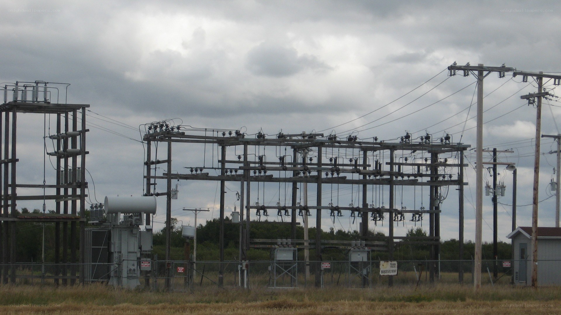 Electrical substation under cloudy sky