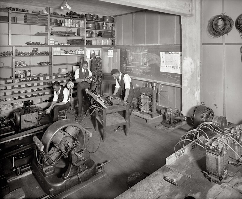 Electricians in workshop