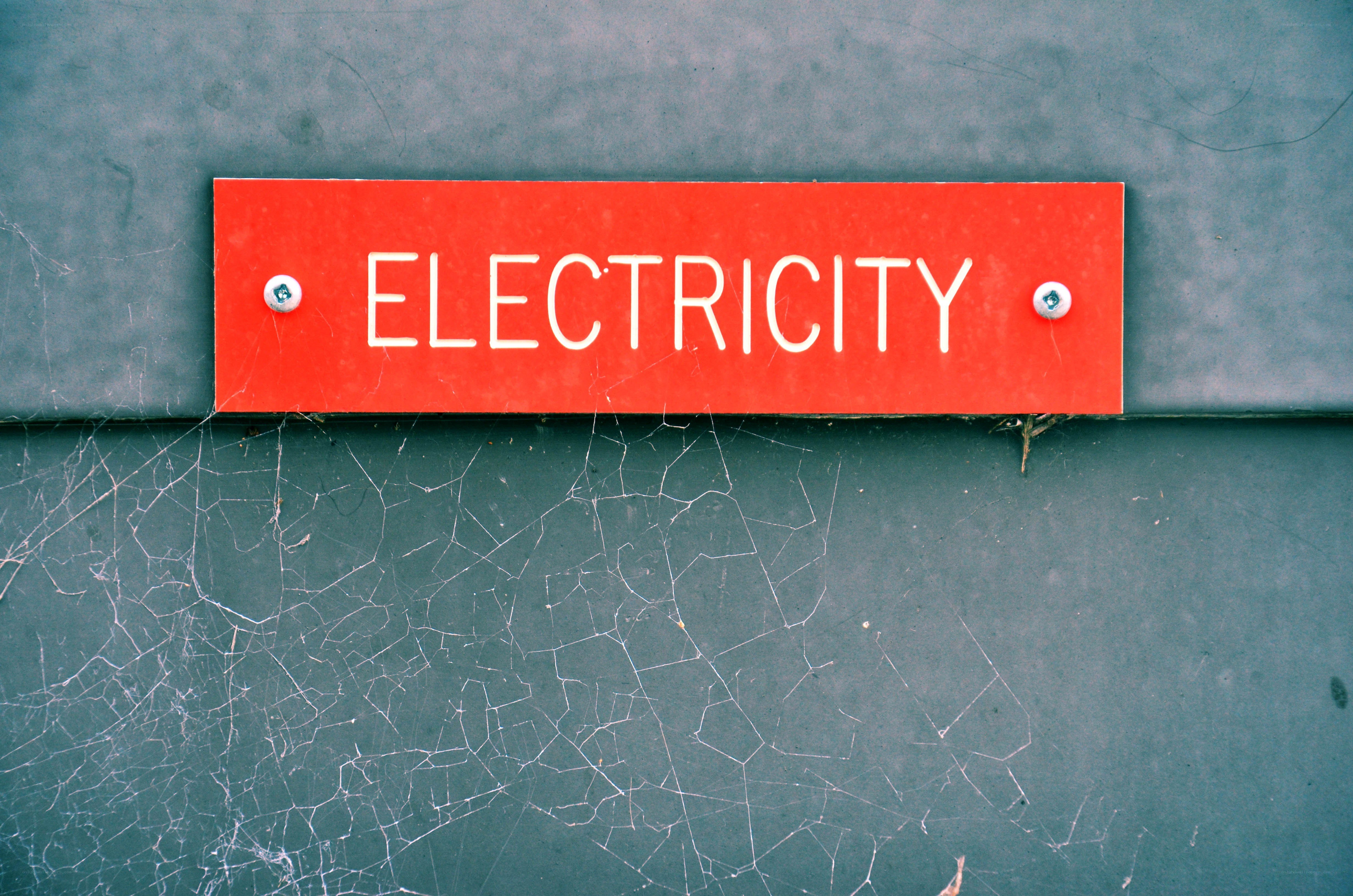 Electricity sign on a wall