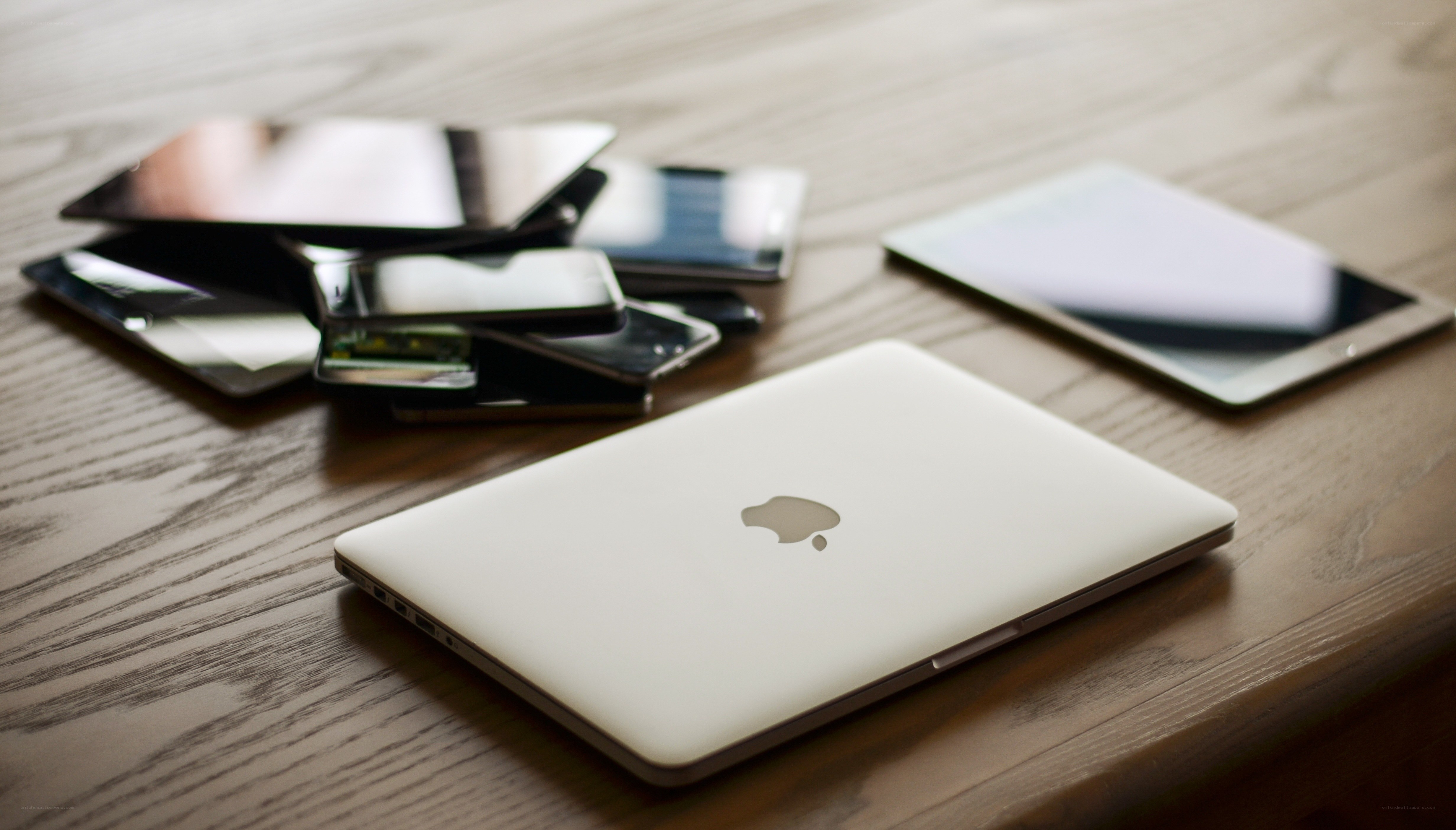 Electronic devices on a wooden table