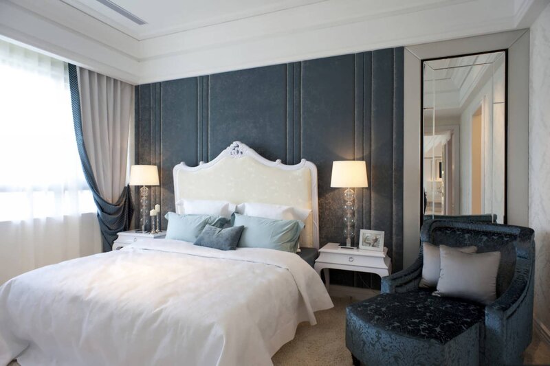 elegant bedroom with dark accent wall