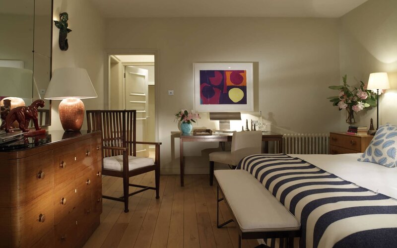 elegant bedroom with striped bed
