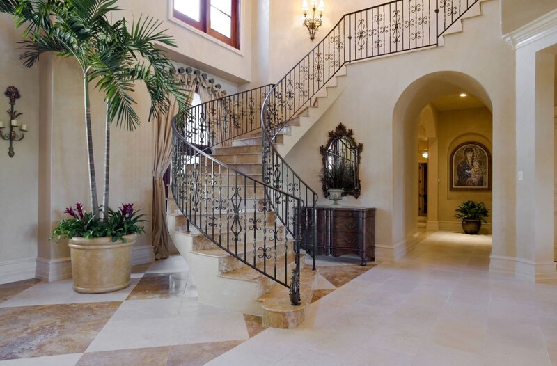 Elegant home entry with spiral staircase