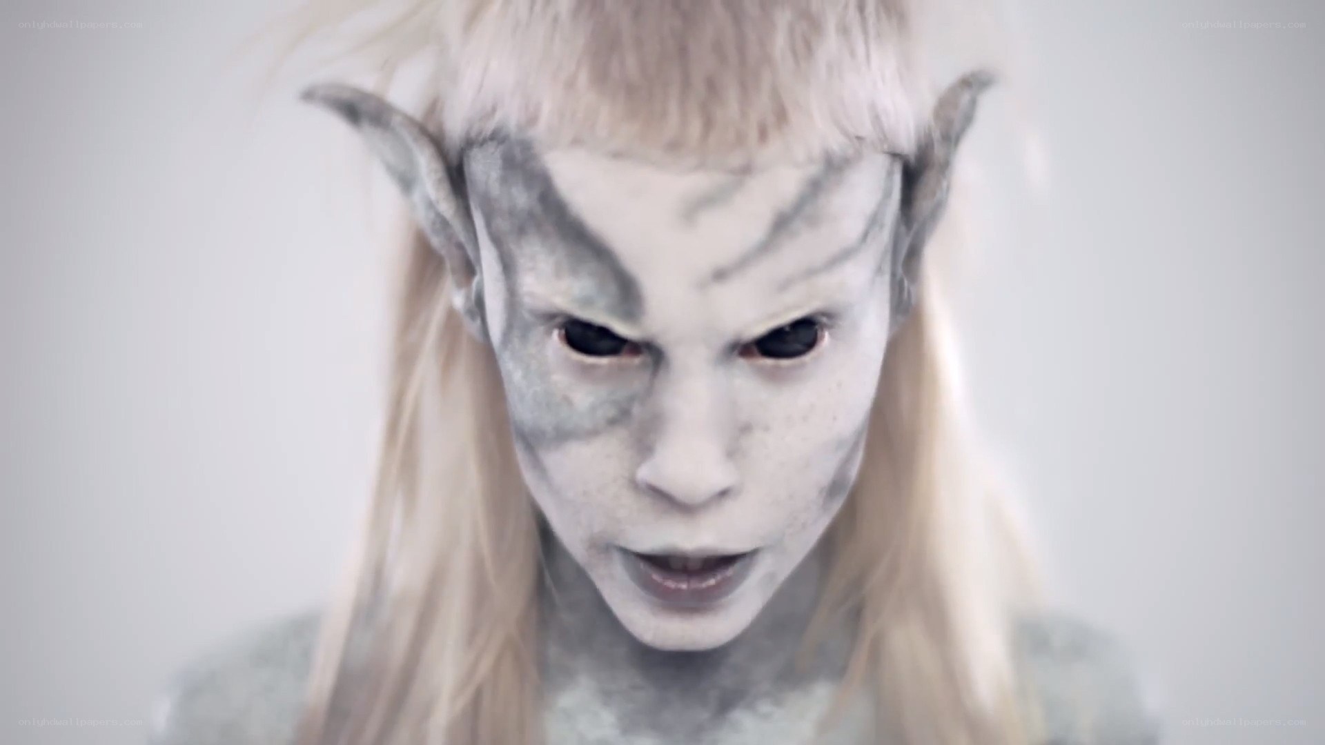 elf character with pale makeup