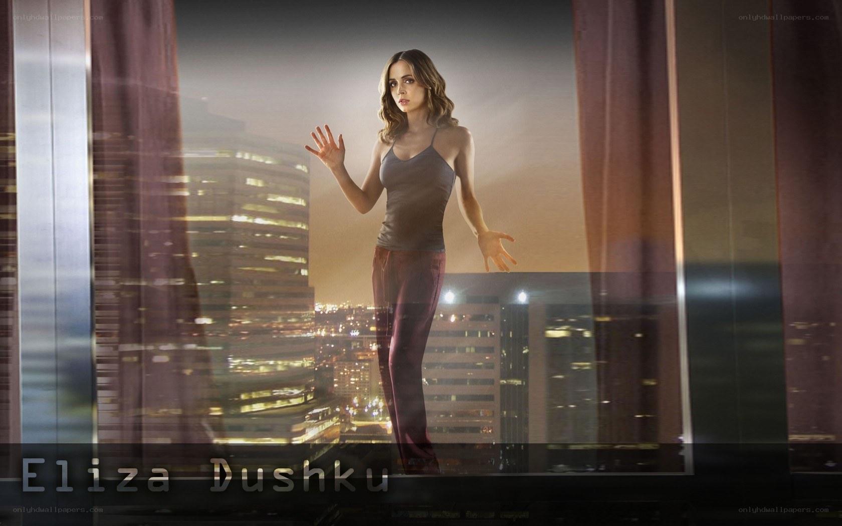 Eliza Dushku in cityscape
