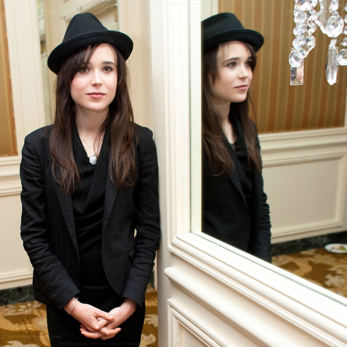 Ellen Page in black hat and blazer