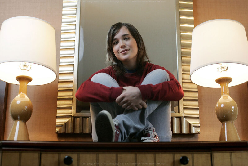 Ellen Page sitting on a table
