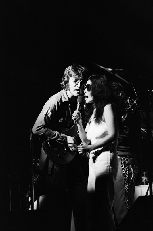 Elton John and Cher performing on stage