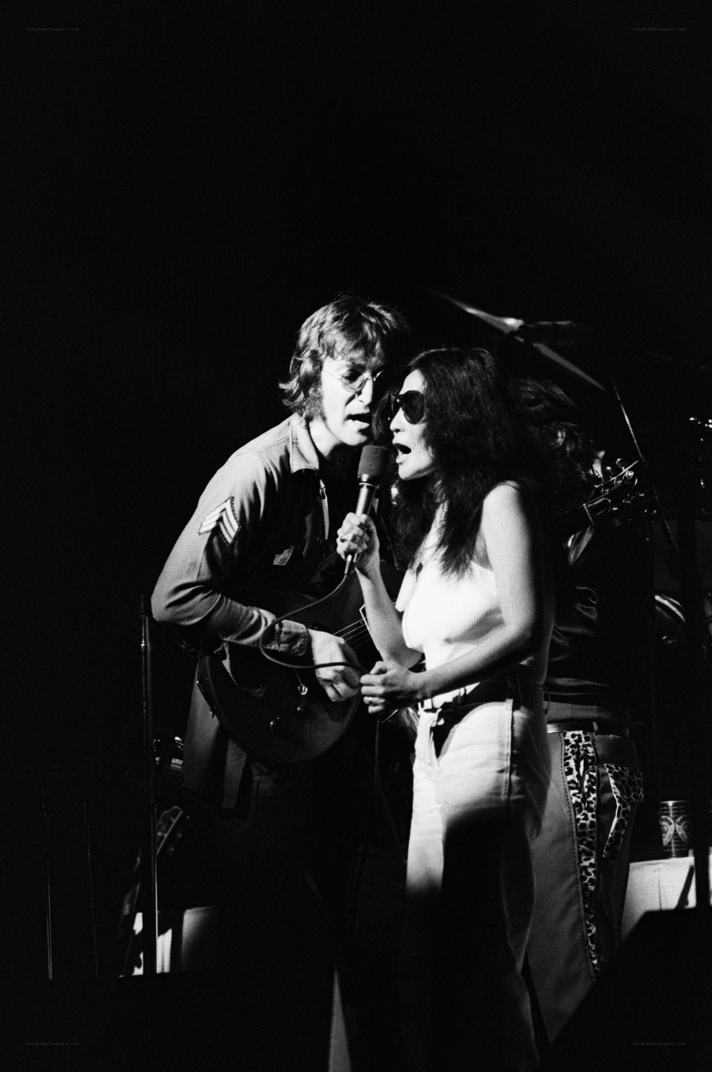 Elton John and Cher performing on stage