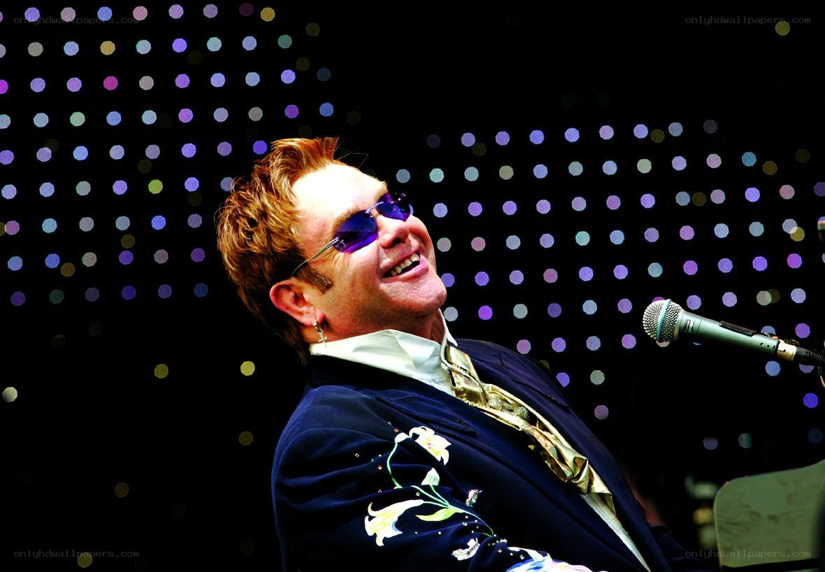 Elton John performing on stage