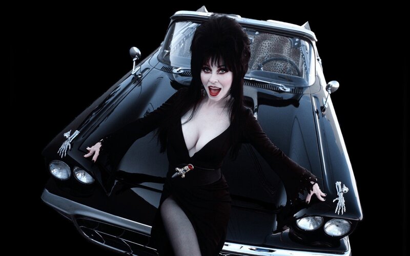 Elvira in front of her car