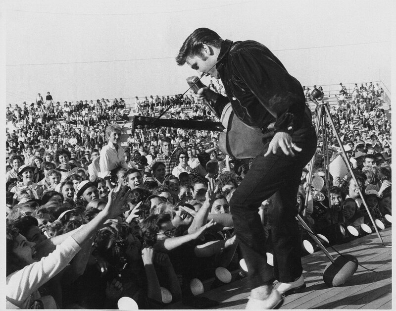 Elvis Presley Performing — Black, Energetic, Afternoon