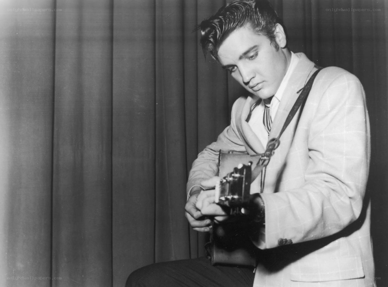 Elvis Presley playing guitar