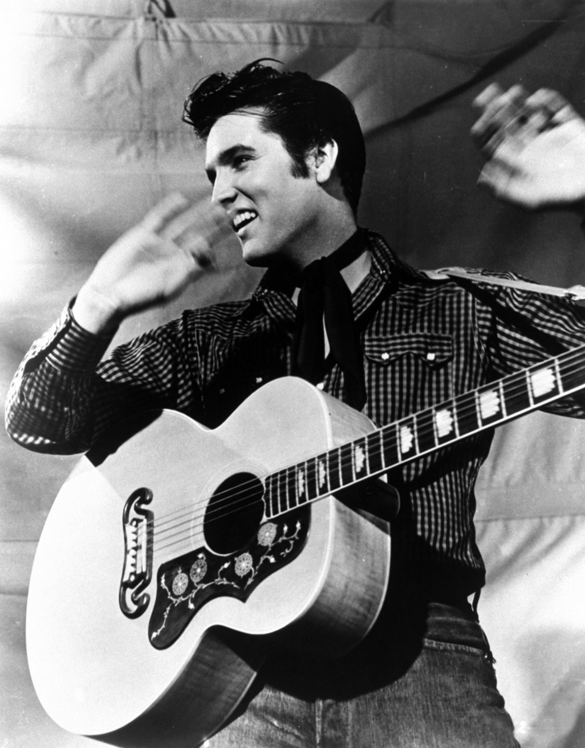 Elvis Presley playing guitar
