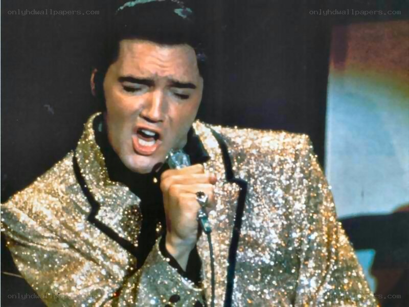 Elvis Presley singing on stage