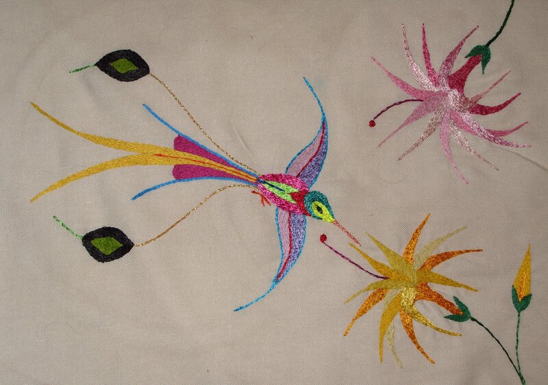 Embroidered hummingbird and flowers