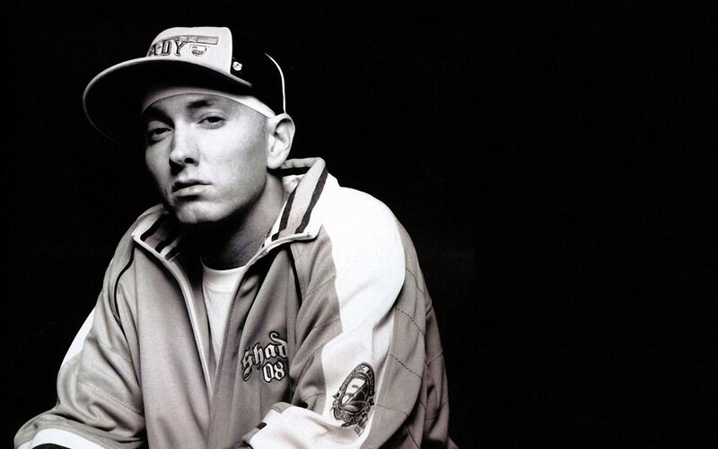 Eminem in a cap and jacket
