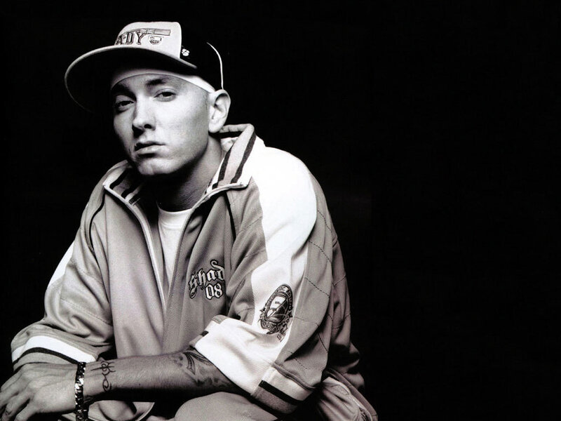 Eminem in a cap and jacket