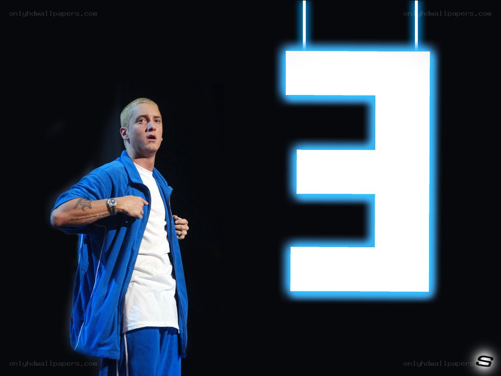 Eminem on stage with logo