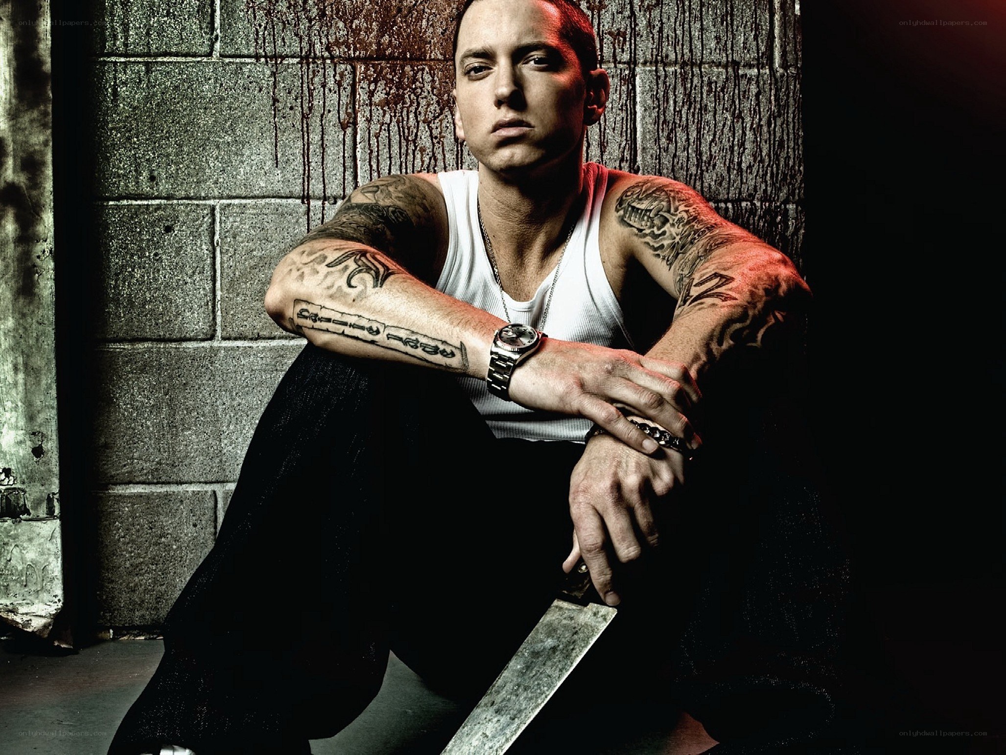 Eminem with knife and tattoos