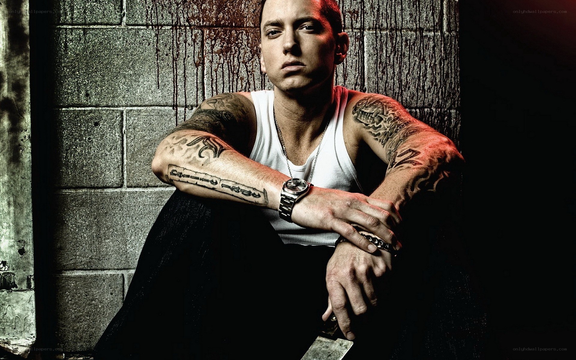Eminem with tattoos and knife