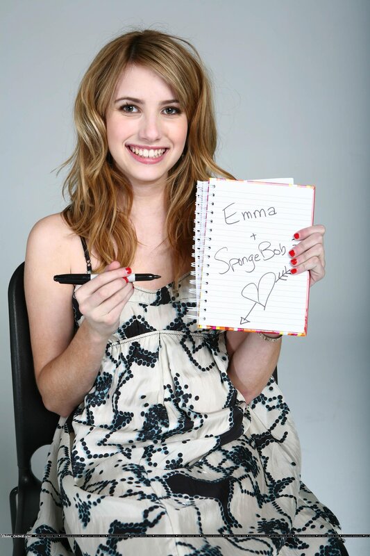 Emma Roberts holding a notebook