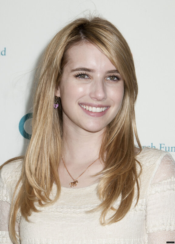 Emma Roberts smiling at event