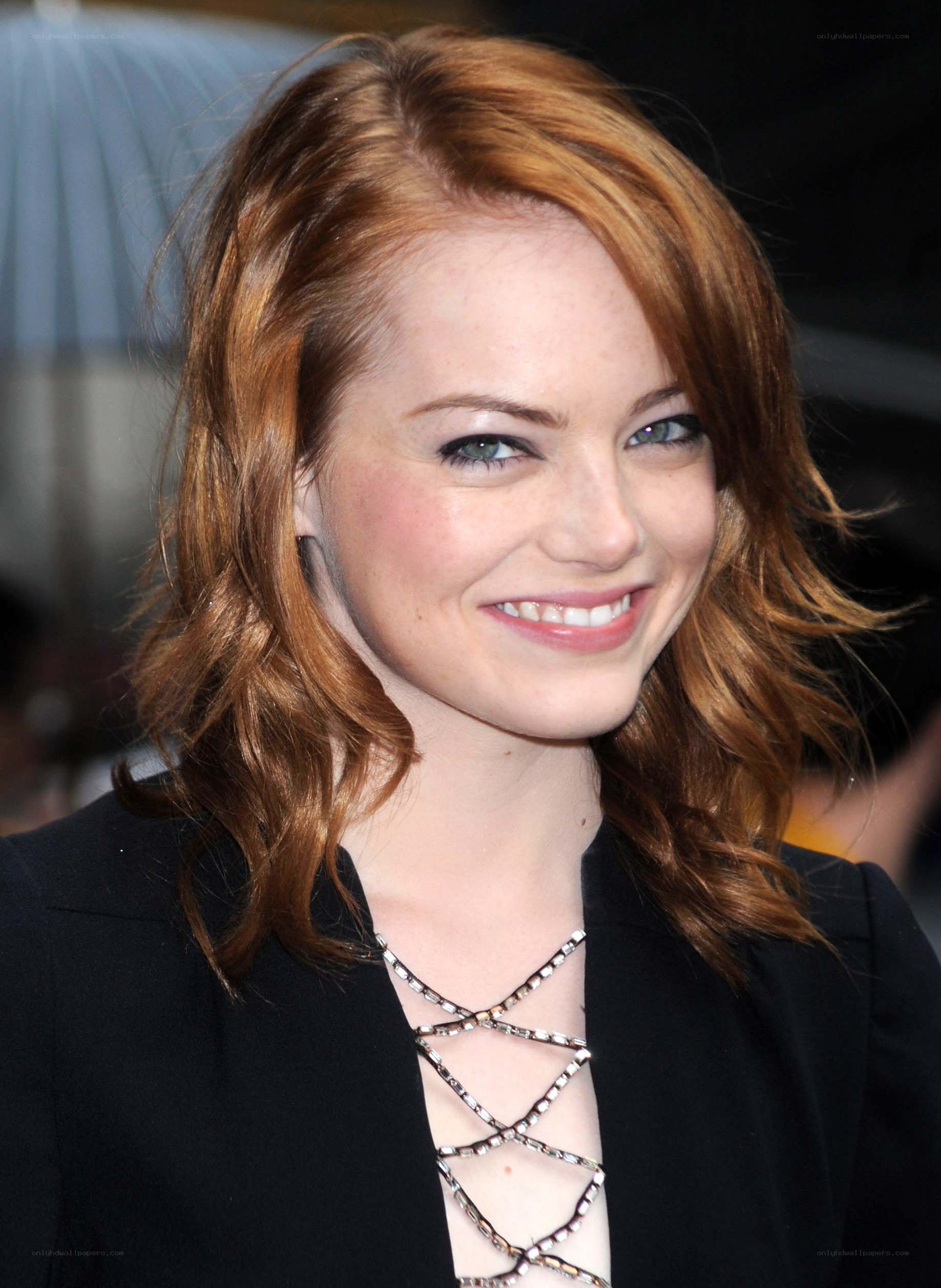 Emma Stone smiling at event