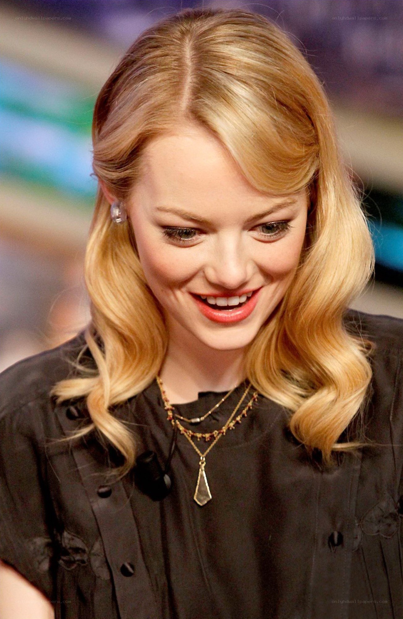 Emma Stone smiling at event