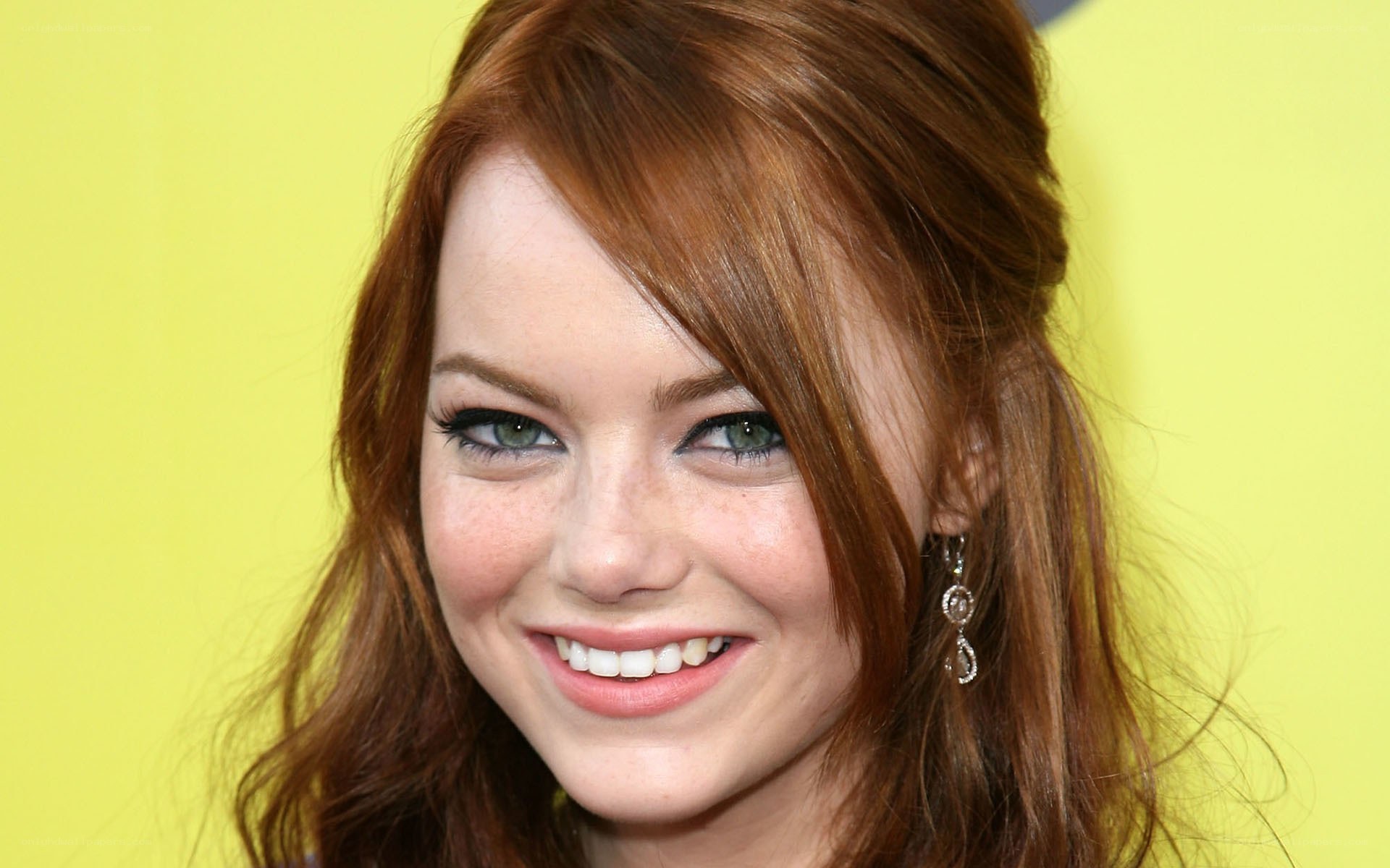 Emma Stone smiling at event