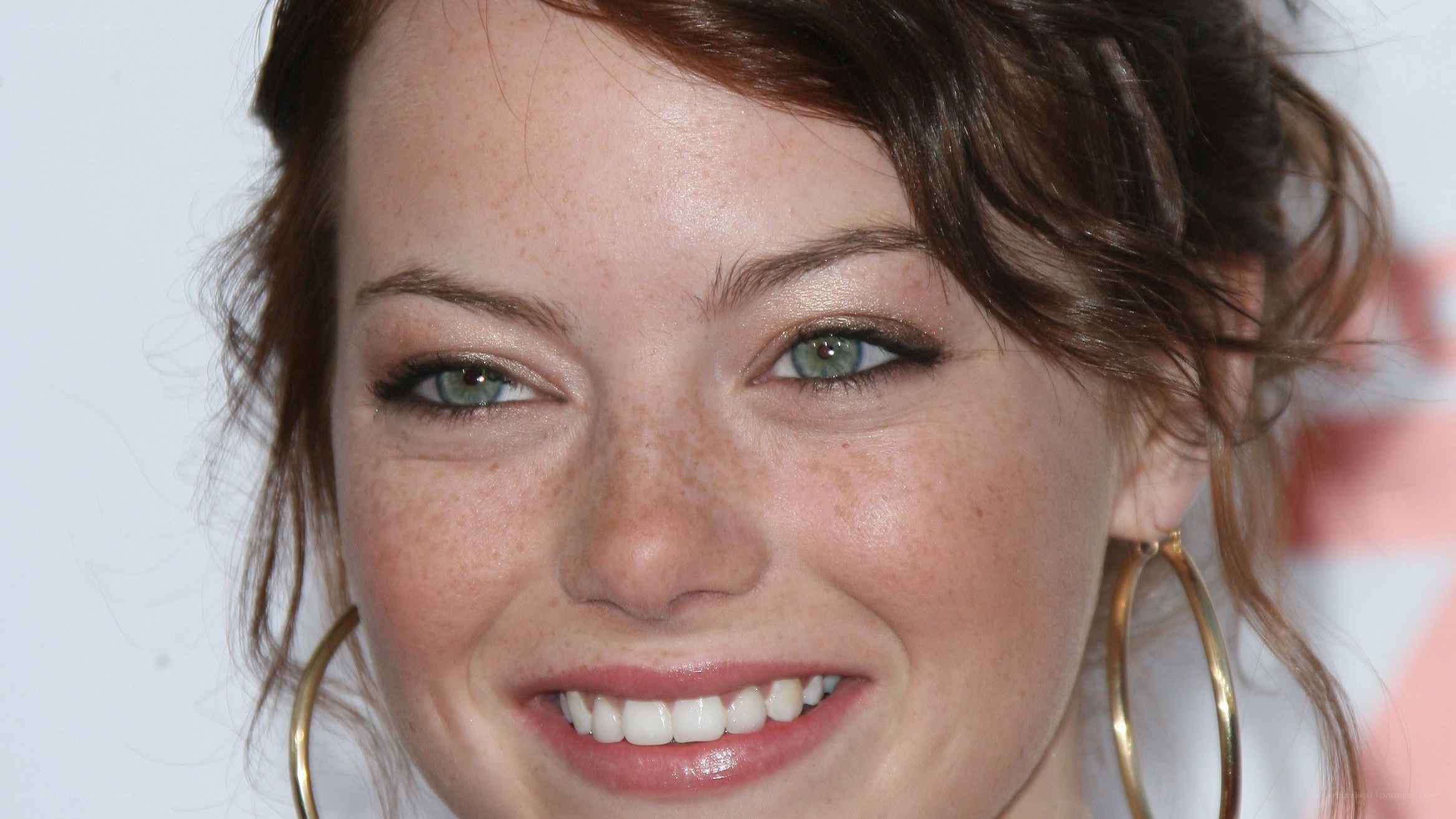 Emma Stone smiling at event