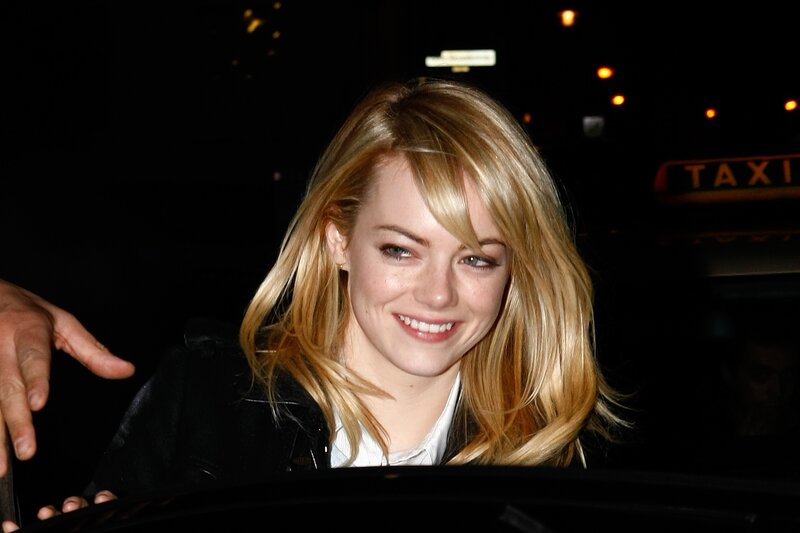 Emma Stone smiling at night