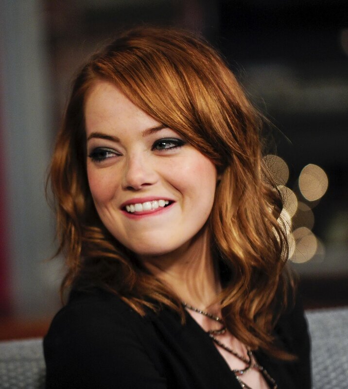 Emma Stone smiling on set