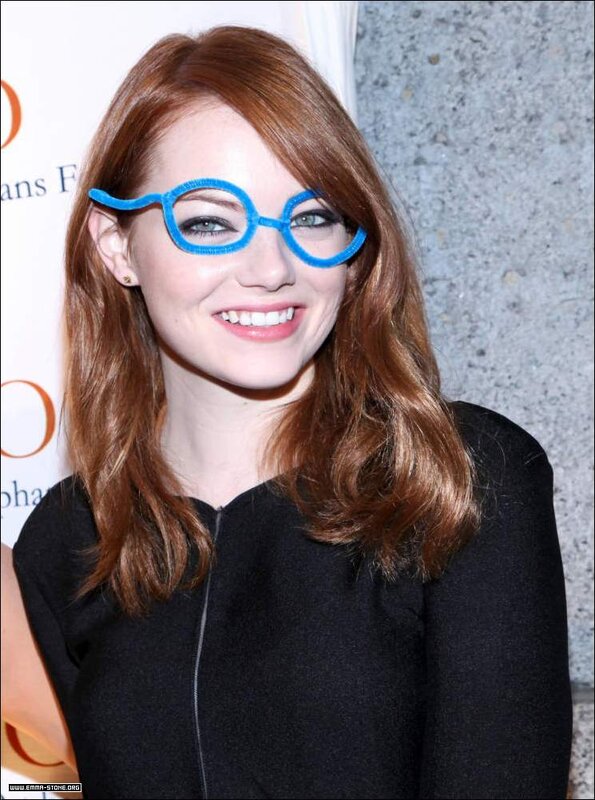 Emma Stone wearing blue glasses