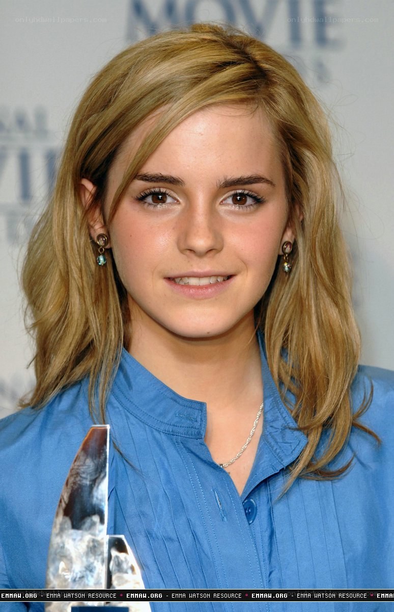 Emma Watson holding award