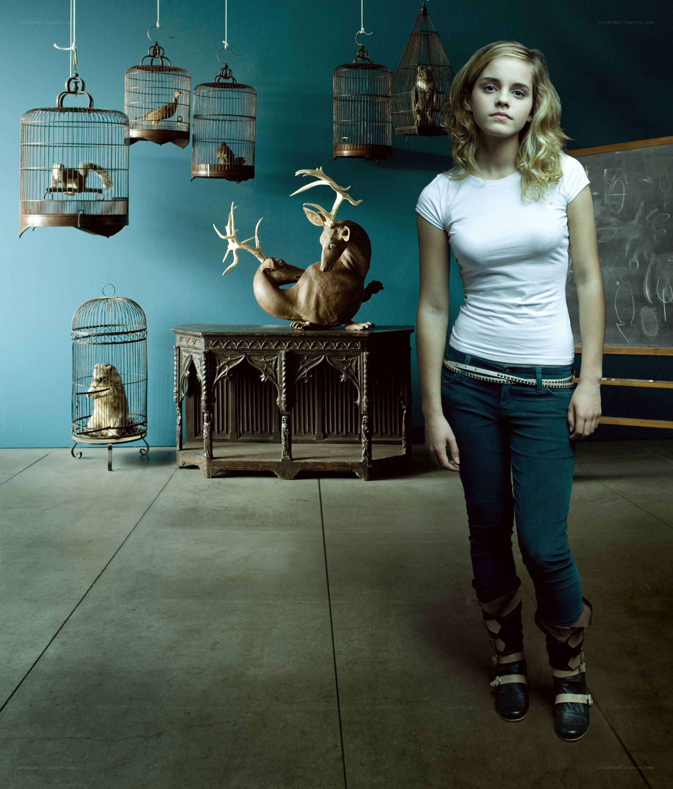 Emma Watson in a studio with birdcages