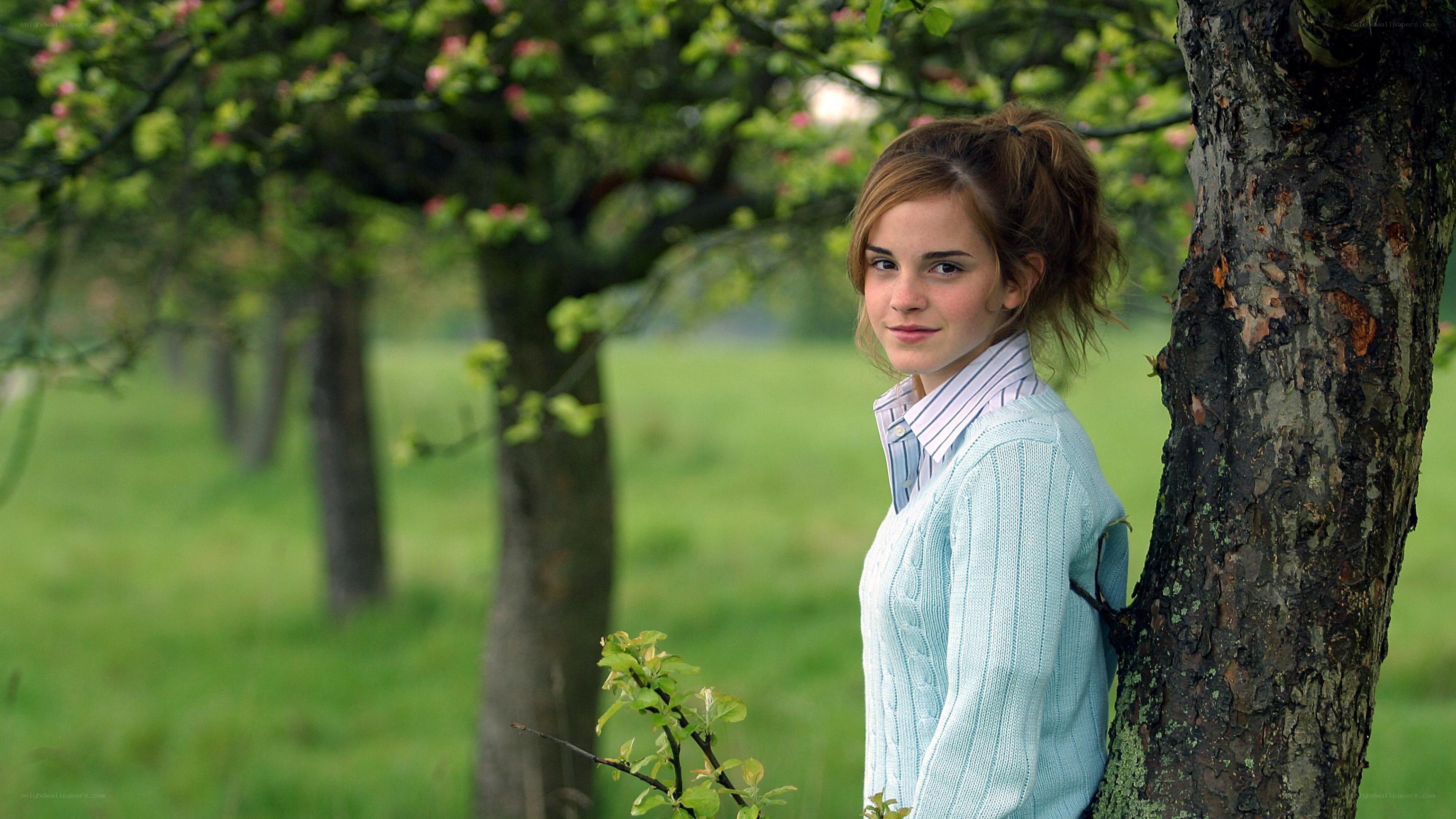 Emma Watson in an orchard