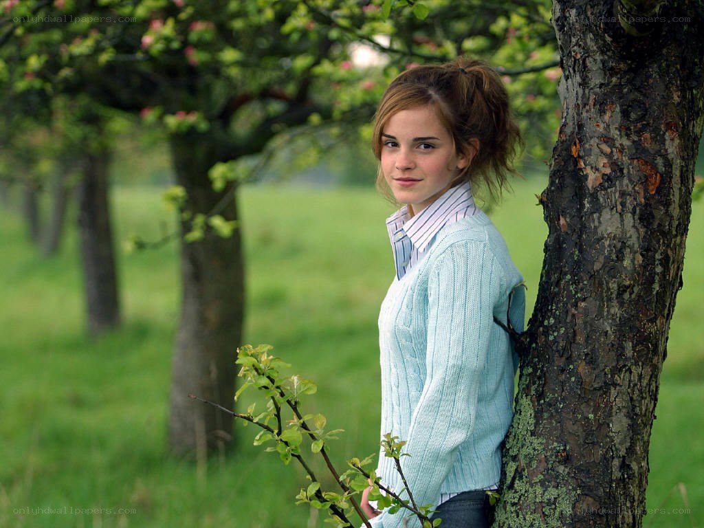 Emma Watson in an orchard