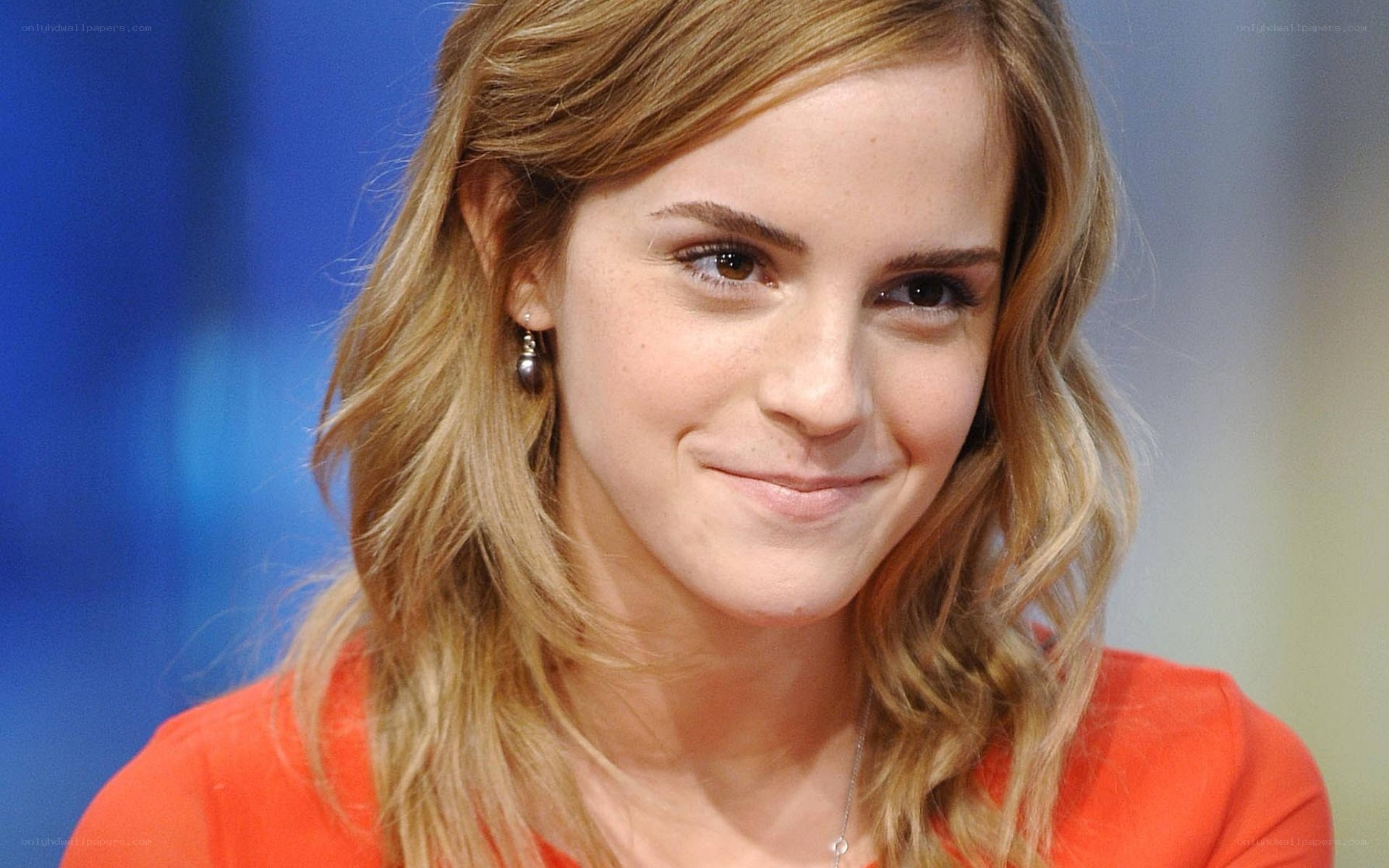 Emma Watson in orange top