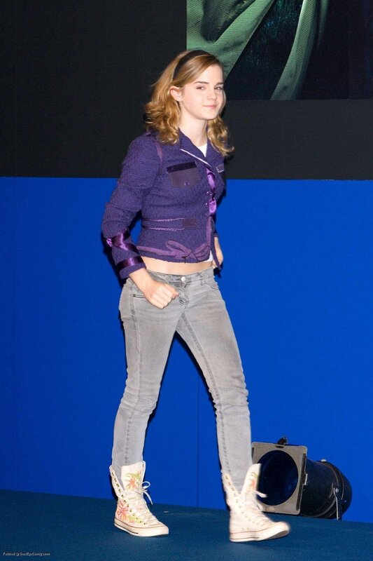Emma Watson in purple jacket