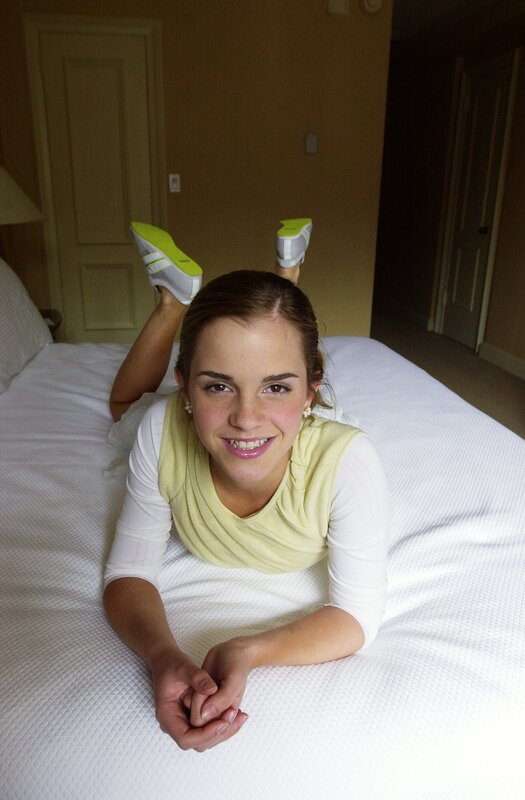 Emma Watson on a bed