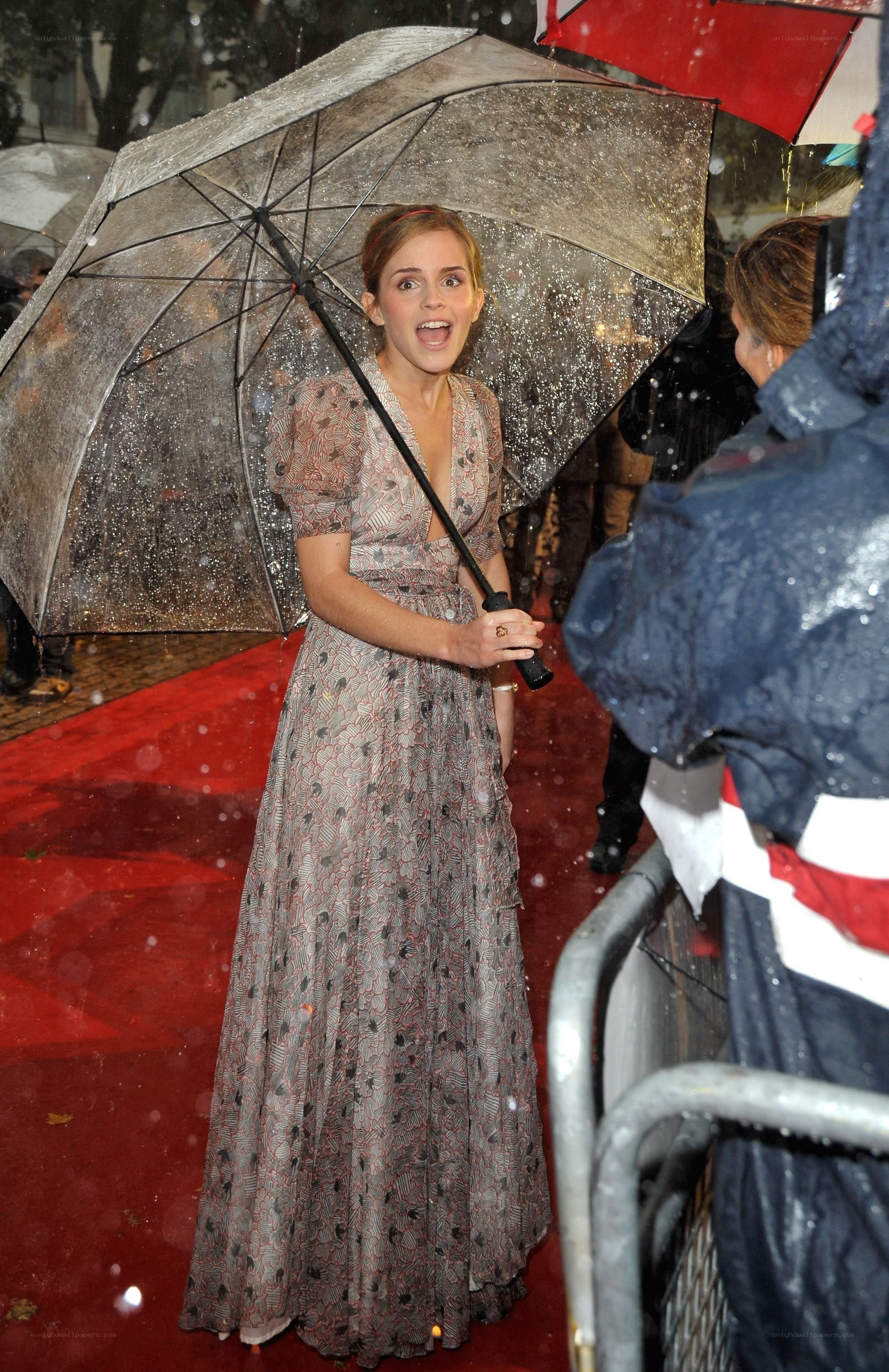 Emma Watson on red carpet in rain