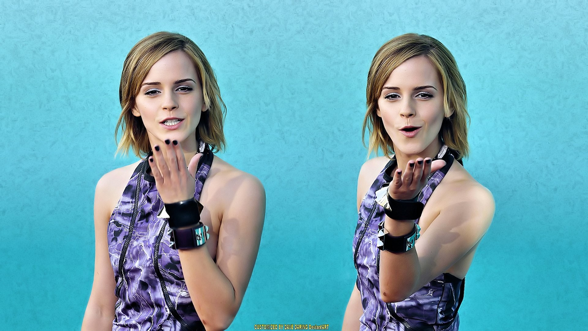 Emma Watson posing against blue wall