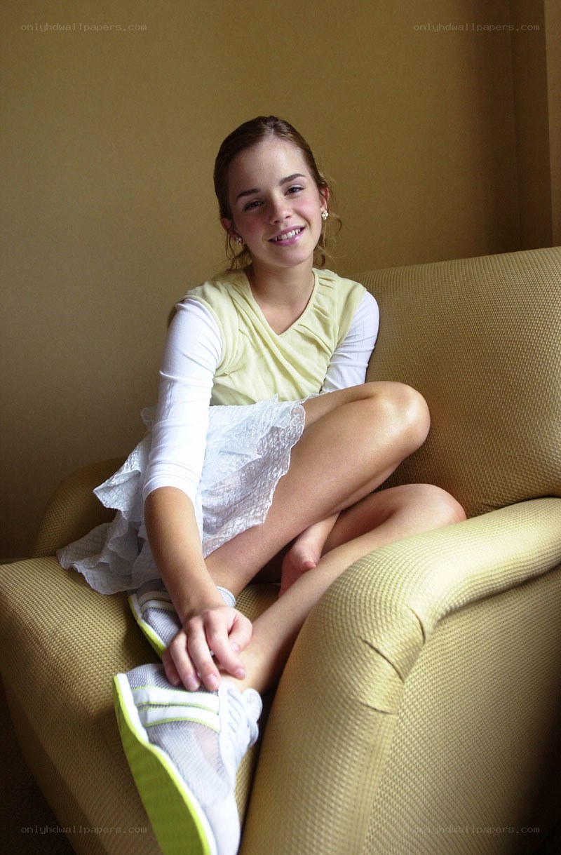Emma Watson sitting on a couch