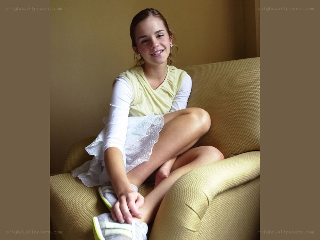 Emma Watson sitting on a couch