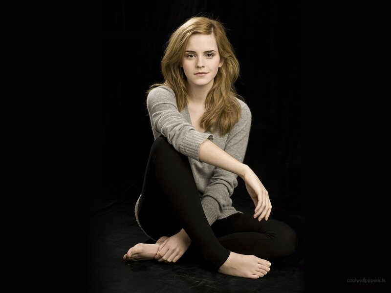 Emma Watson sitting on floor