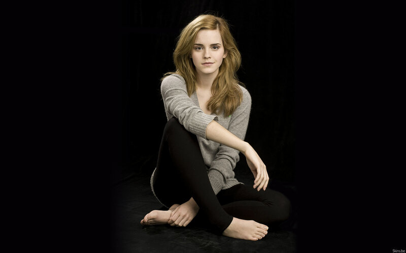 Emma Watson sitting on floor