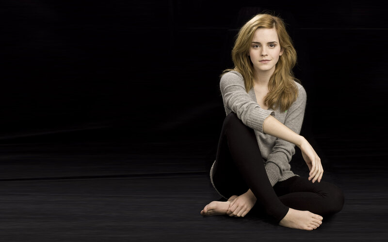 Emma Watson sitting on floor